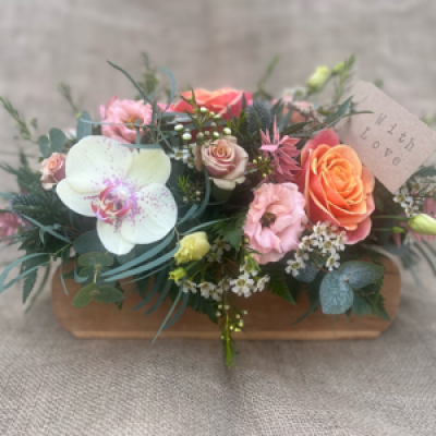 Wooden brick mould arrangement  - Beautiful seasonal arrangement presented in a wooden brick mould. 